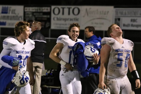 Sophomores Max Pallini (left) and Michael Gregory (middle) and Junior Andrew Zipp (right) celebrate after the playoff win.