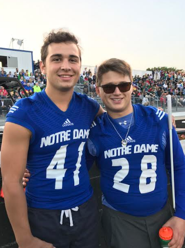 James Bosco with Nick Koehler at a Friday night football game.